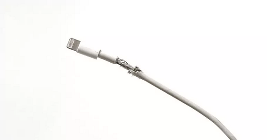 The damaged iPhone cable malfunctions